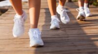 group of people walking on beach for exercising in the morning