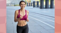 fit, happy brunette woman running outdoors