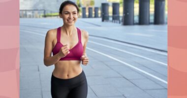 fit, happy brunette woman running outdoors