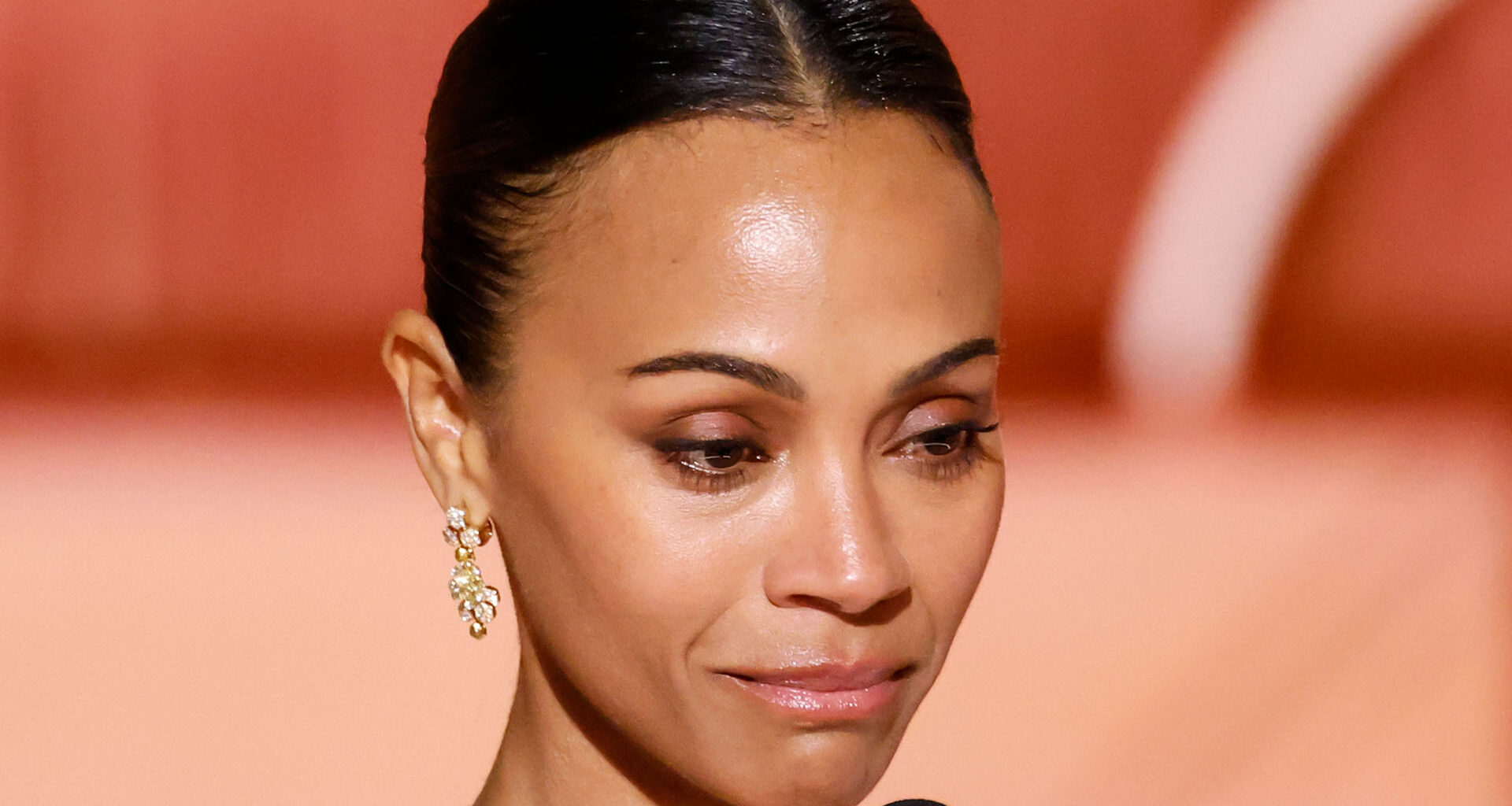 Zoe Saldana bizarrely crashes Golden Globes stage during Best Song speech as ’embarrassed’ fans beg star to ‘sit down’