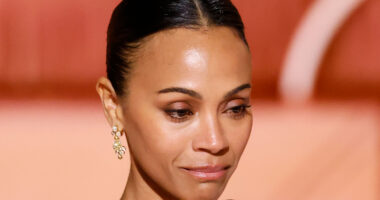 Zoe Saldana bizarrely crashes Golden Globes stage during Best Song speech as ’embarrassed’ fans beg star to ‘sit down’