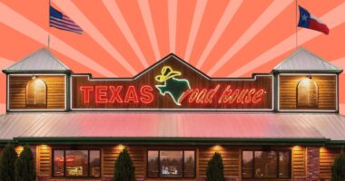 Storefront of a Texas Roadhouse restaurant against a colorful background