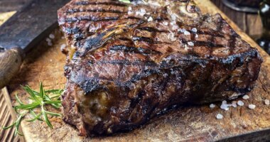 dry ages barbecue porterhouse steak on cutting block