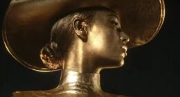 Beyonce sizzles as she’s painted in gold in raunchy perfume advert pictures