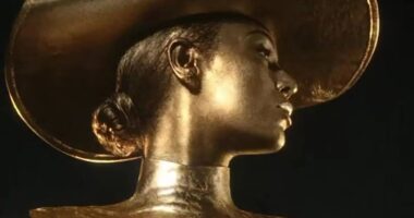 Beyonce sizzles as she’s painted in gold in raunchy perfume advert pictures