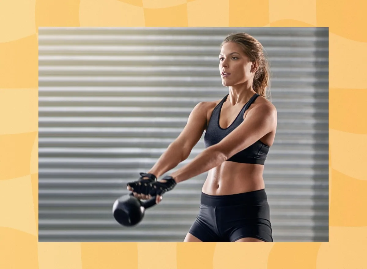 fit, focused woman doing kettlebell swing exercise