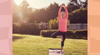 senior woman in pink long-sleeve top and black leggings doing balancing exercise or tree pose on yoga mat in sunny backyard